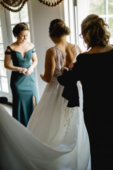 Bride getting into her dress