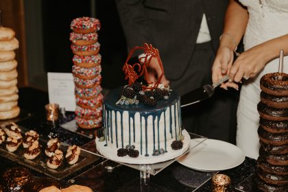 Cutting the Cake Pastry Works with Donut Towers for Wedding Reception